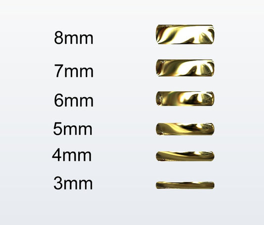 Set of gold D-shaped rings with varying widths on a white background