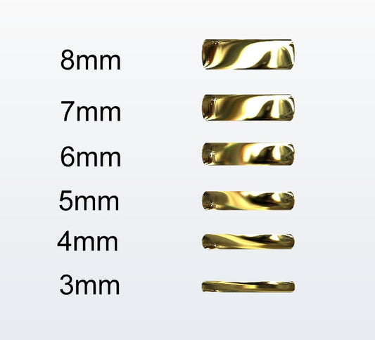 Set of gold D-shaped rings with varying widths on a white background
