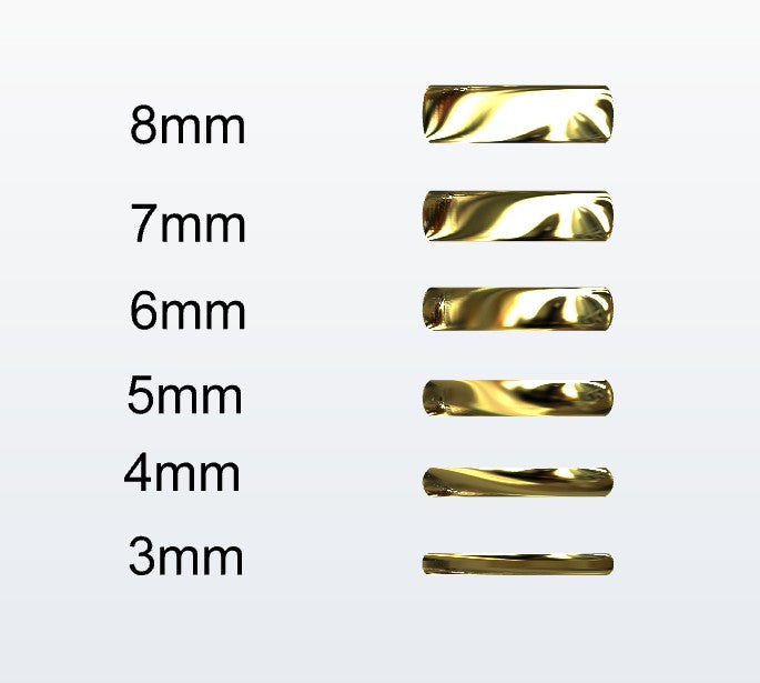 Set of gold D-shaped rings with varying widths on a white background