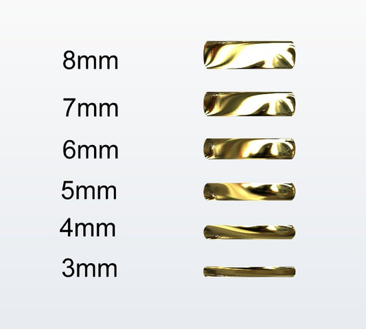 Set of gold D-shaped rings with varying widths on a white background