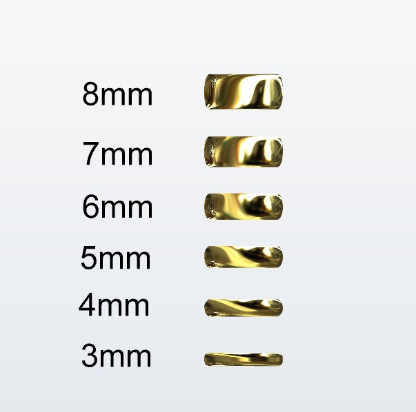 Set of gold D-shaped rings with varying widths on a white background