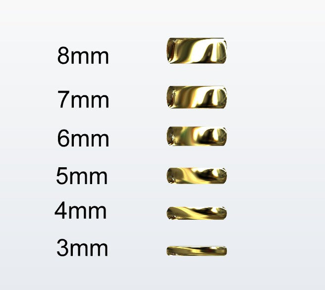 Set of gold D-shaped rings with varying widths on a white background