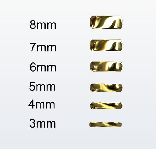 Set of gold D-shaped rings with varying widths on a white background