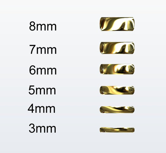 Set of gold D-shaped rings with varying widths on a white background