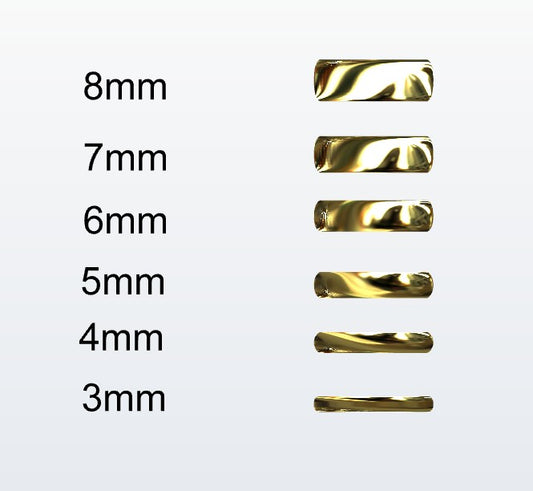 Set of gold D-shaped rings with varying widths on a white background