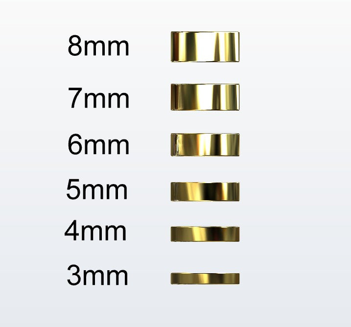 Set of gold flat profile rings with varying widths on a white background