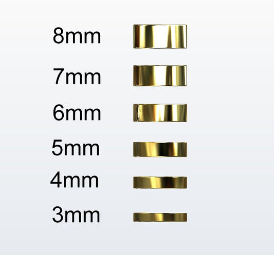 Set of gold flat profile rings with varying widths on a white background