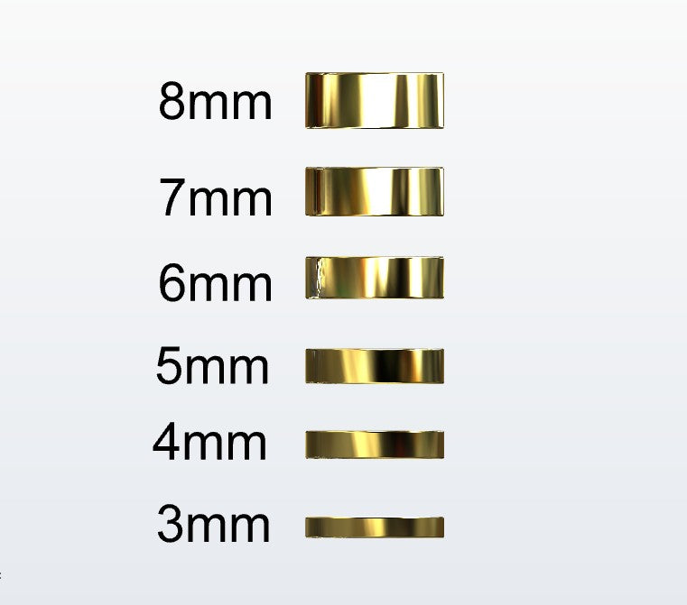 Set of gold flat profile rings with varying widths on a white background
