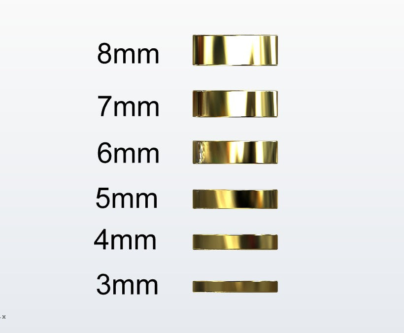 Set of gold flat profile rings with varying widths on a white background